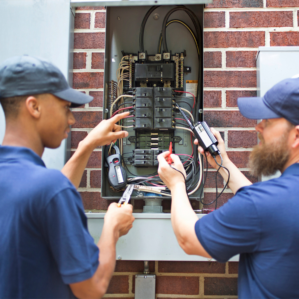 a man holding a electrical device